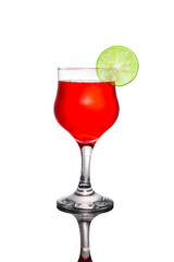 Red cocktail and lime on white background.