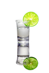 Vodka shot with lime slice and salt.On the white background.