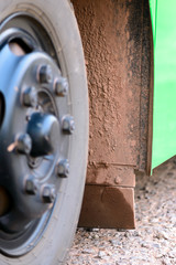 Dirty mudguard of truck in rainy day.