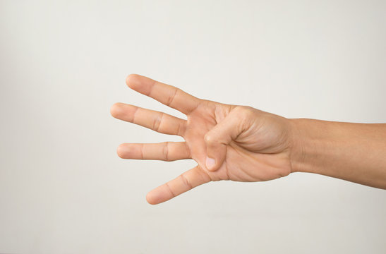 Male hand is showing four fingers isolated