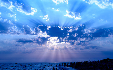 blue sky, clouds, rays and sea shore
