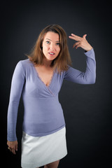 Beautiful woman doing different expressions in different sets of clothes: you are crazy