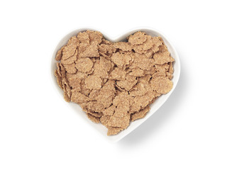 heart shaped bowl bran cereal - Stock Image