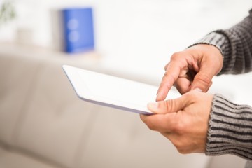 Close up view of hands using tablet