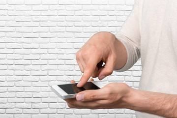 Man's hand holding smartphone