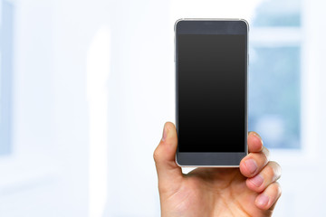 Man's hand holding smartphone