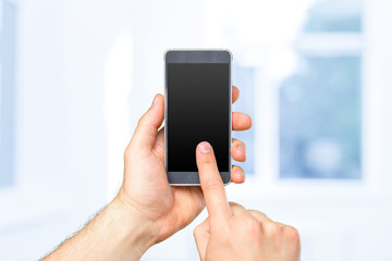 Man's hand holding smartphone