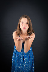 Obraz premium Beautiful girl doing different expressions in different sets of clothes: kiss