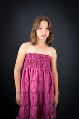 Obraz premium Beautiful girl doing different expressions in different sets of clothes: bored