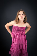 Obraz premium Beautiful girl doing different expressions in different sets of clothes: tired
