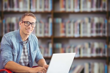 Composite image of hipster on laptop