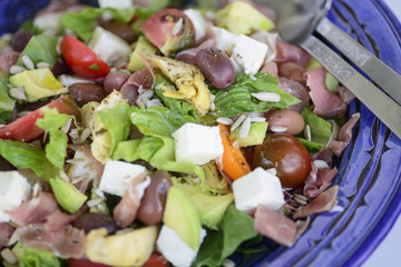 Fresh summer salad in blue bowl