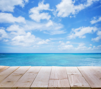 Wood Table With Blur  Seascape And Blue Sky Background