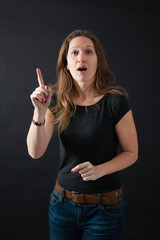 Obraz premium Beautiful woman doing different expressions in different sets of clothes: want to speak