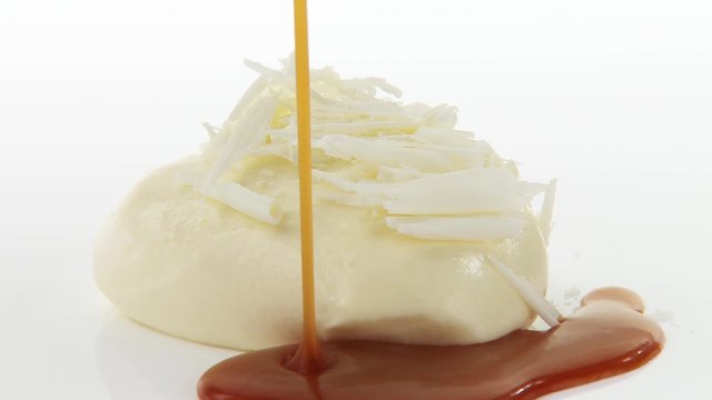 White chocolate mousse with chocolate curls & caramel sauce