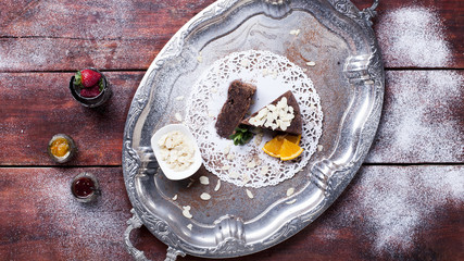 Chocolate cake, ice cream and strawberries on a plate, bird's-eye view, studio shot