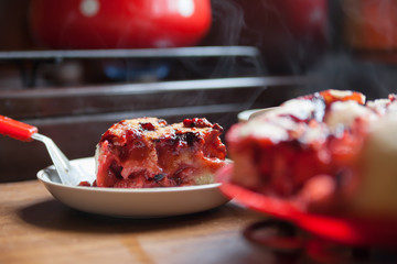  pie on   plate with   cut pieces.
