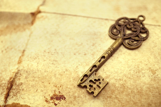 Old key on old paper

