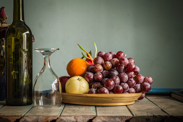 Fruit tray and a glass