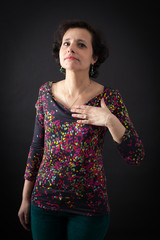 beautiful woman doing different expressions in different sets of clothes: heart attack