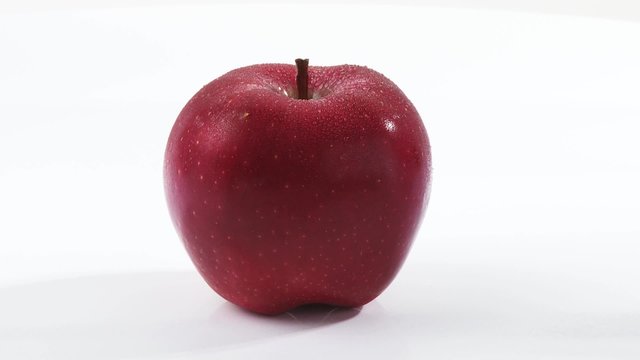 A rotating red apple
