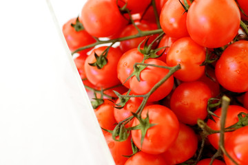 cherry tomatoes on a branch in a box