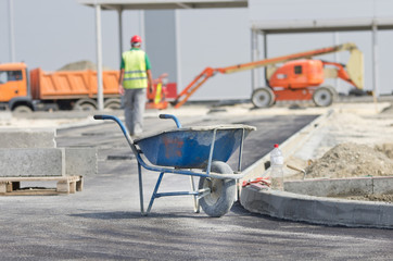Fototapeta na wymiar Wheelbarrow at construction site