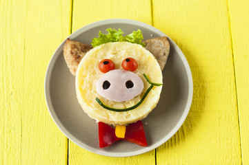 Creative food for child. Pig  cooked mashed potatoes on plate.