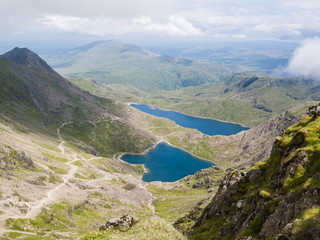 Fototapeta na wymiar High view from Mount Snowdon to Glaslyn and Llyn Llydaw lakes with worn Pyg Track and Miners Track footpaths. Snowdonia National Park Wales UK Britain