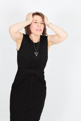 Fototapeta premium Beautiful woman doing different expressions in different sets of clothes: headache