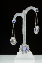 earrings with blue stones on the black 