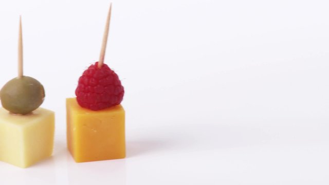 Cheese, fruit and olives on cocktail sticks
