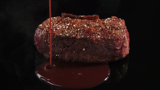 Plating fried beef sirloin with red sauce