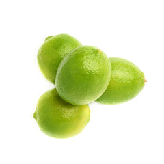 Pile of multiple ripe limes, composition isolated over the white