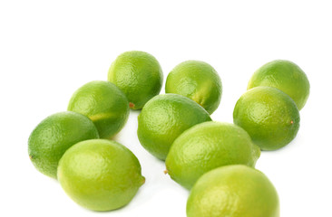 Surface covered with multiple ripe limes, composition isolated