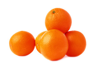 Pile of multiple ripe oranges, isolated over the white