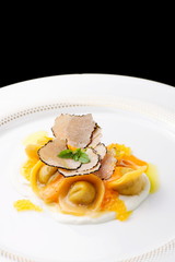 Italian ravioli tortellini with caviar, basil and black truffles