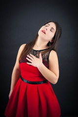 Fototapeta premium Beautiful woman doing different expressions in different sets of clothes: heart attack
