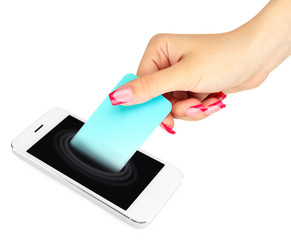 Mobile phone with credit card in hand isolated on white