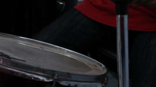 closeup man playing drums