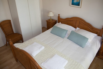 Fototapeta na wymiar Double bed in the modern interior room