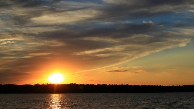 Sunset at river,  time-lapse