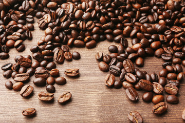 Coffee beans on wooden background