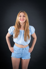 Beautiful girl doing different expressions in different sets of clothes: smile