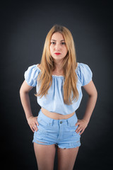 Beautiful girl doing different expressions in different sets of clothes: angry