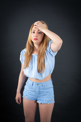 Beautiful girl doing different expressions in different sets of clothes: worried