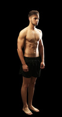 Muscle young man on dark background