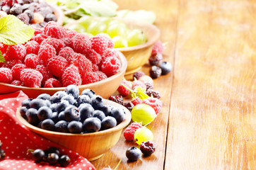 Wooden bowls with organic berries