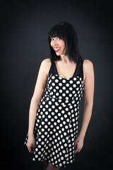 Naklejka premium Beautiful woman doing different expressions in different sets of clothes: smile