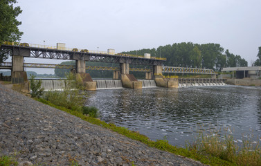Fototapeta na wymiar Weir across a river to regulate its flow
